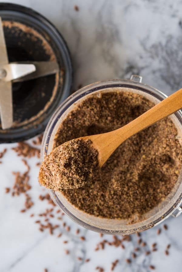 ground flaxseed on a spoon