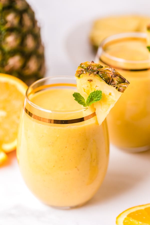 tropical smoothie recipe with pineapple garnish