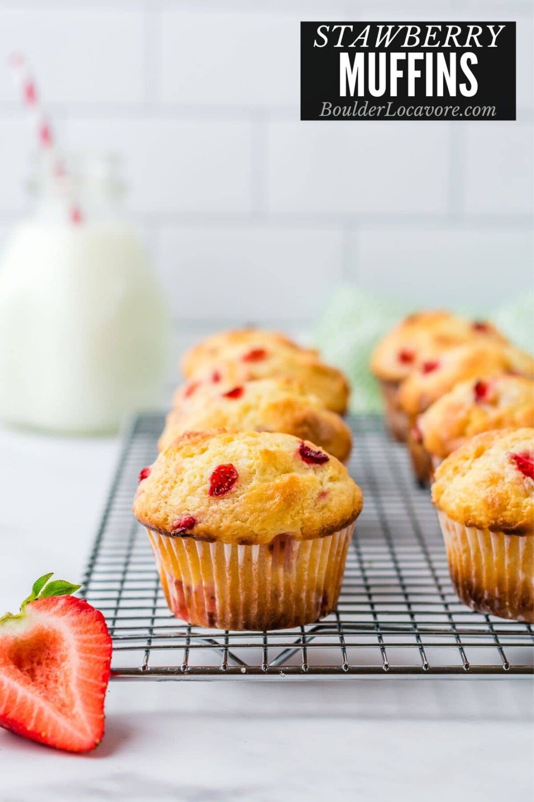 strawberry muffins on cooling rack with title text