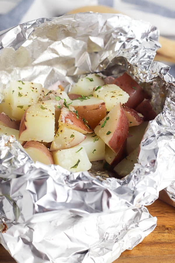grilled potatoes in foil packets with herbs