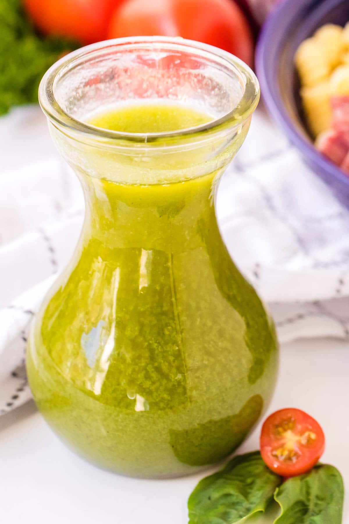 glass carafe of Italian Dressing for pasta salad