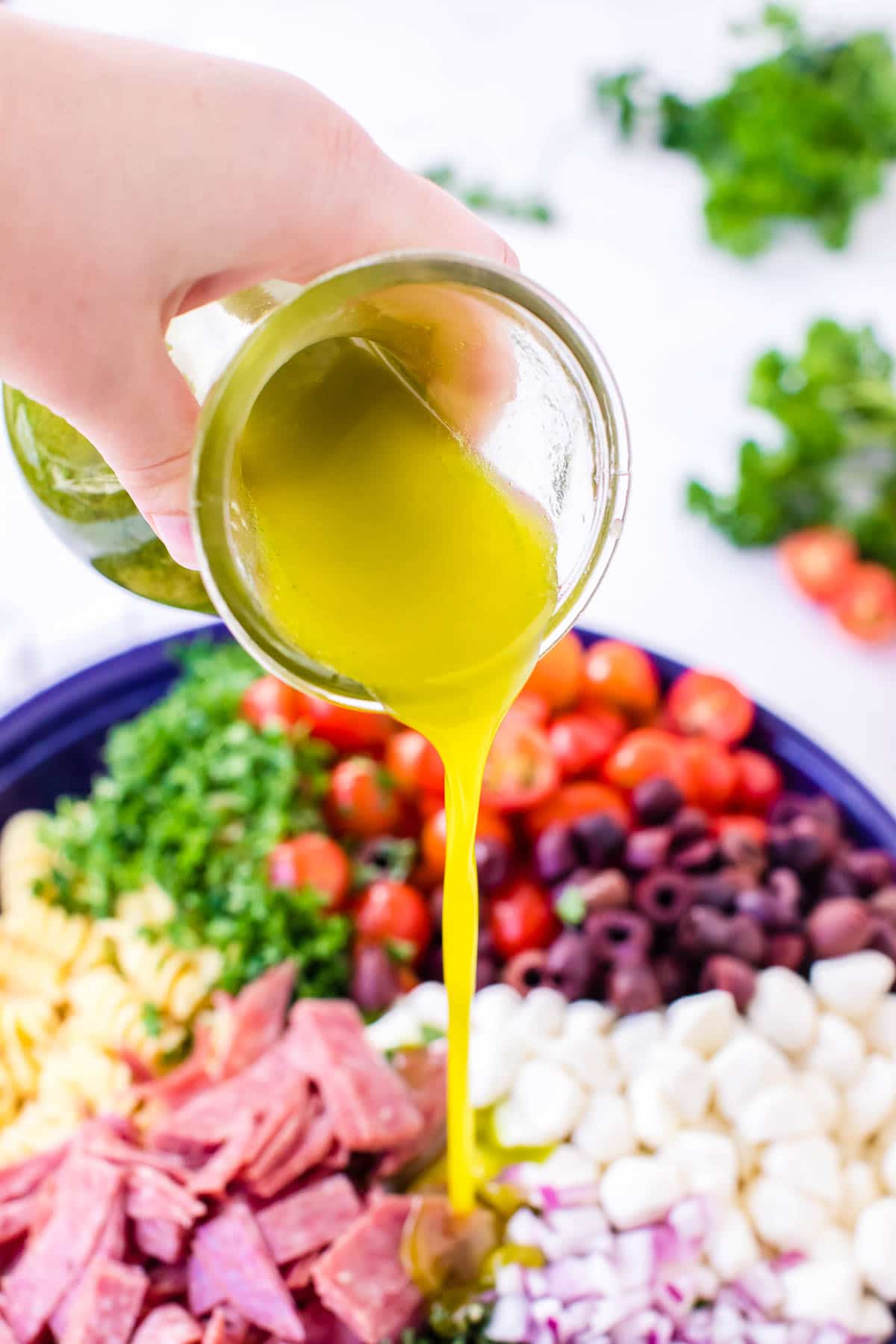 Italian Dressing for pasta salad (pouring onto the salad)