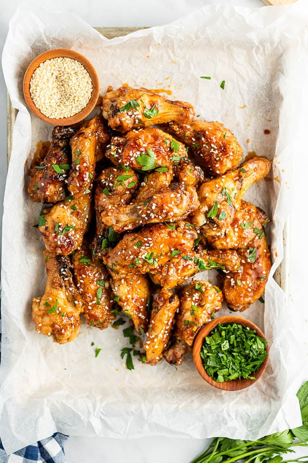 sticky grilled chicken wings on parchment paper