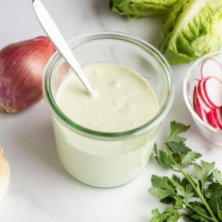 Green Goddess Dressing in a glass jar with spoon and recipe title image