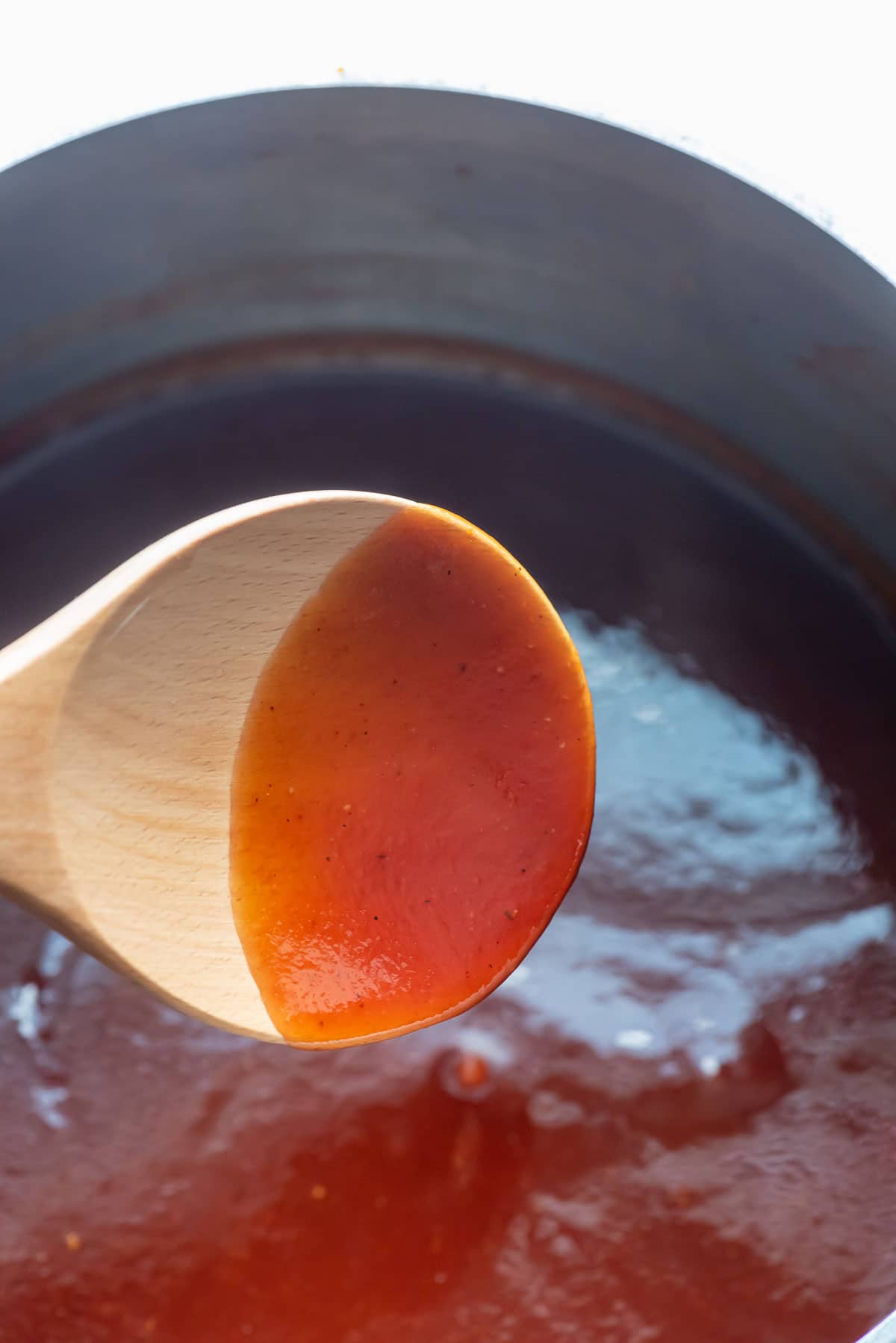 barbecue sauce on spoon cooking