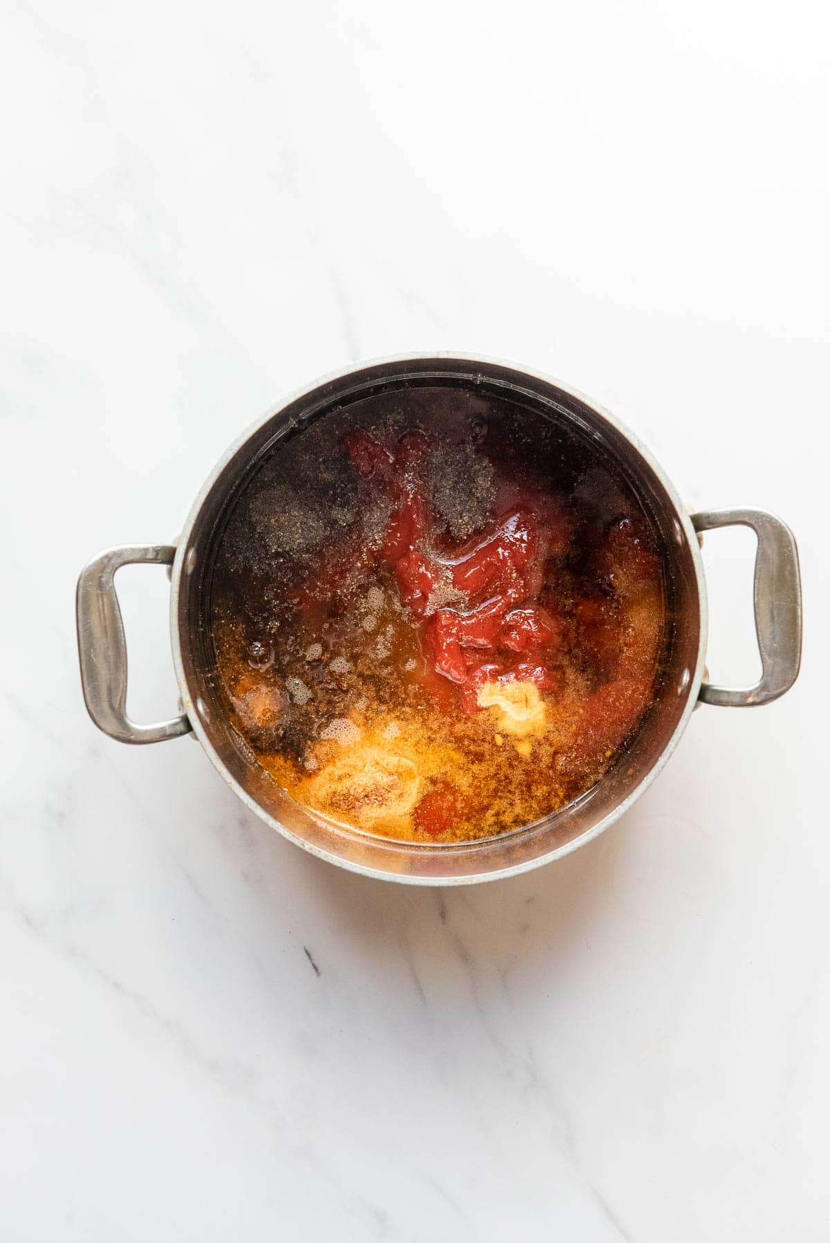 ingredients for homemade barbecue sauce in a sauce pan