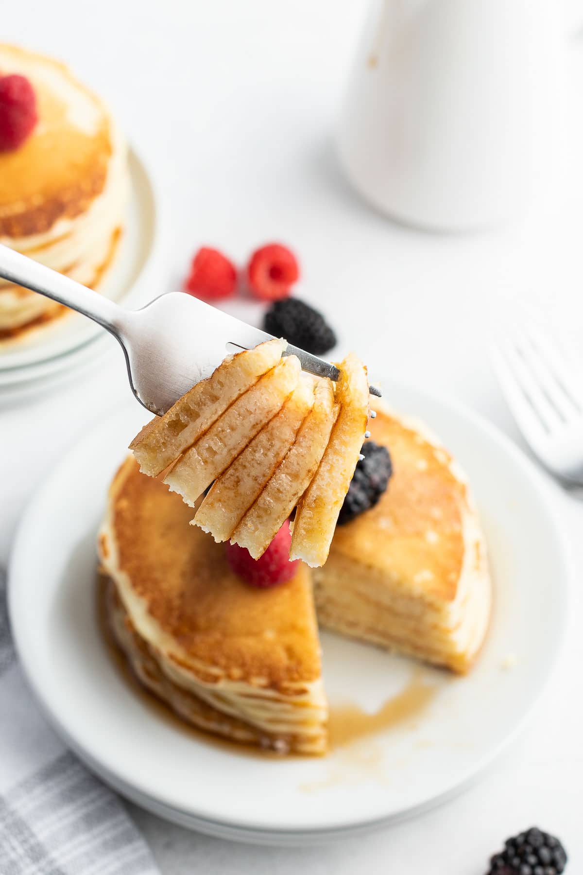 buttermilk pancakes bite on fork close up