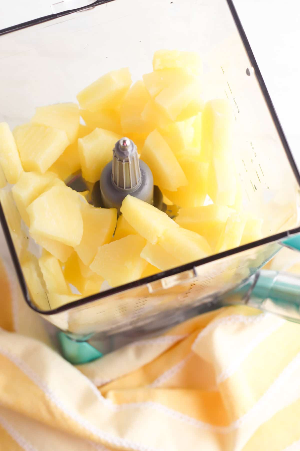 frozen pineapple in blender with lemonade