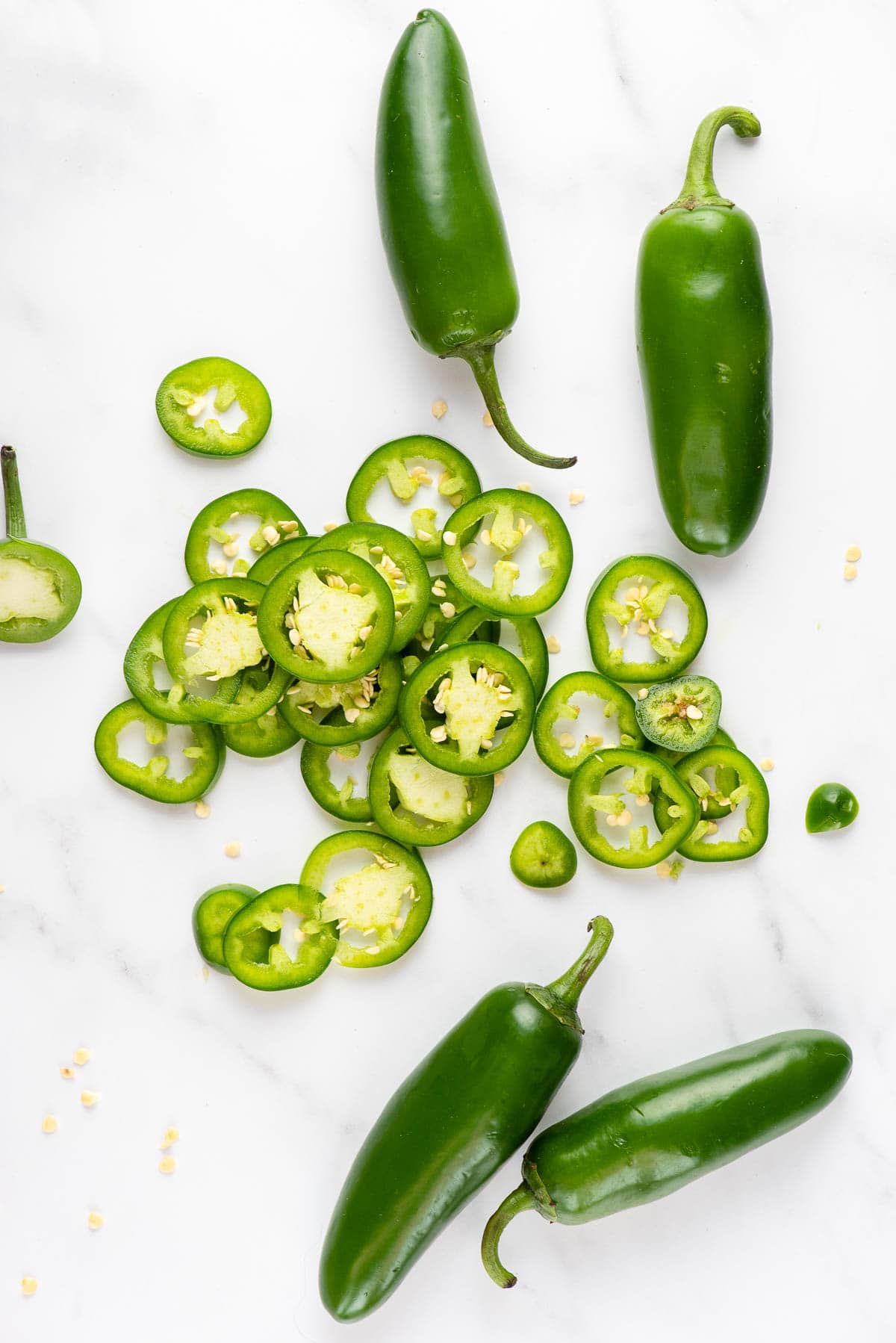 sliced jalapenos and whole jalapeno peppers