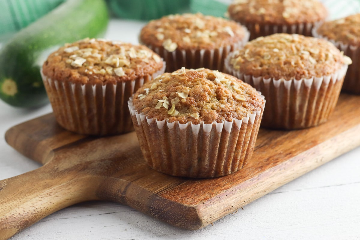 zucchini muffins on handled cutting board - horizontal 