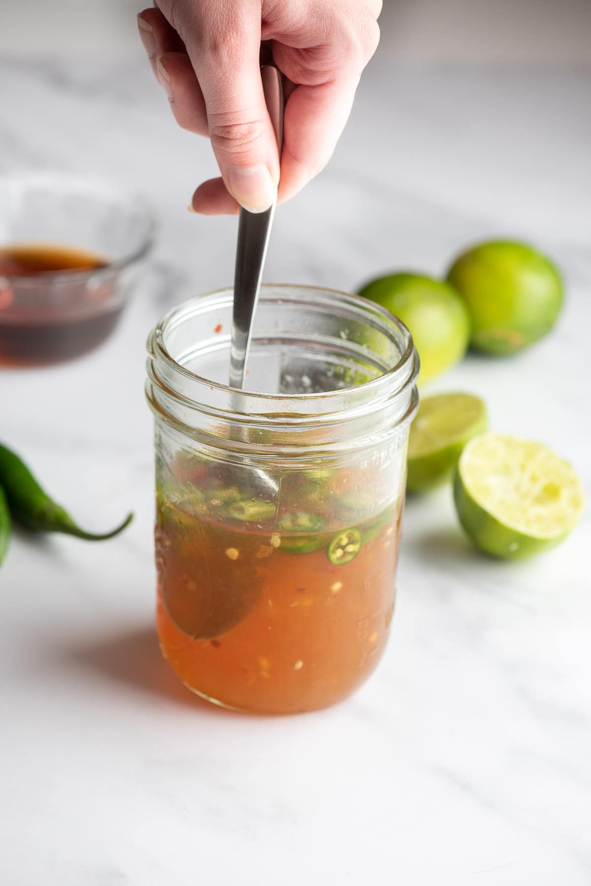 making nuoc cham dipping sauce in a jar