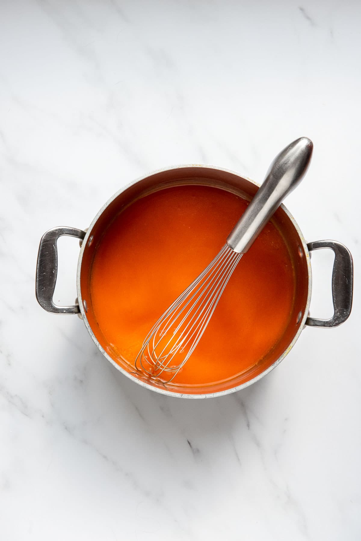 whisking buffalo sauce