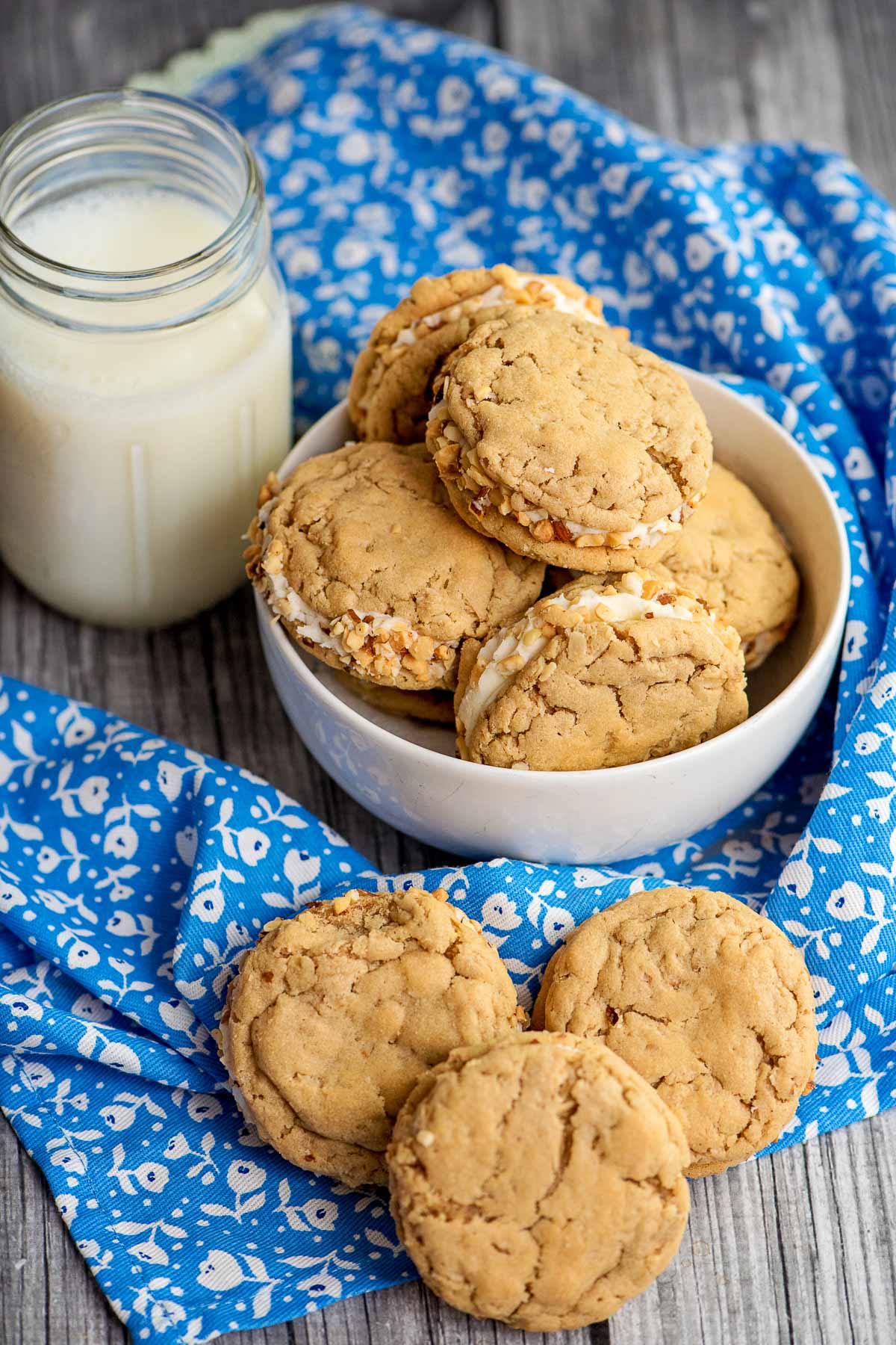 homemade sandwich cookies with a jar of milk