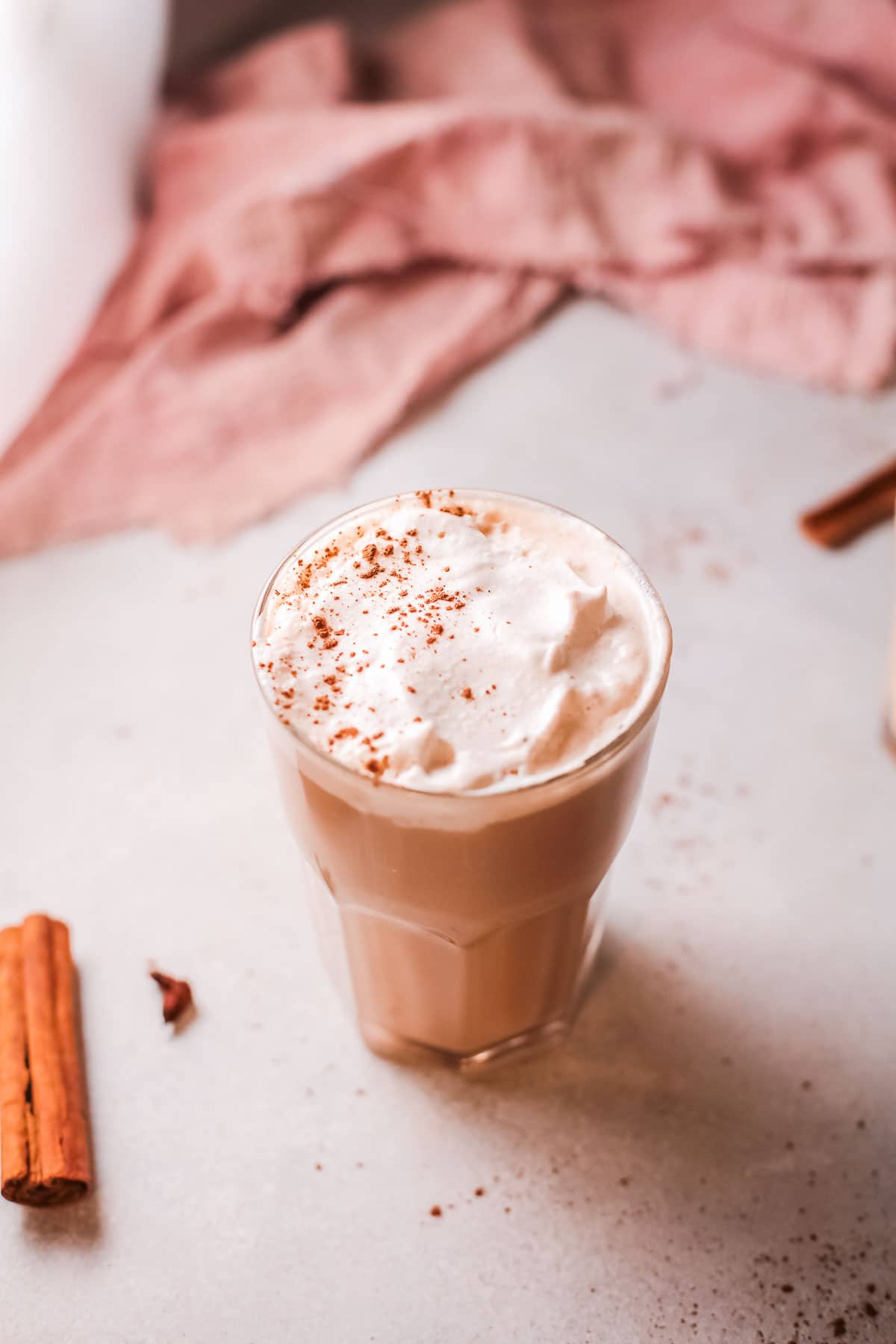 Chai latte in a tall glass overhead