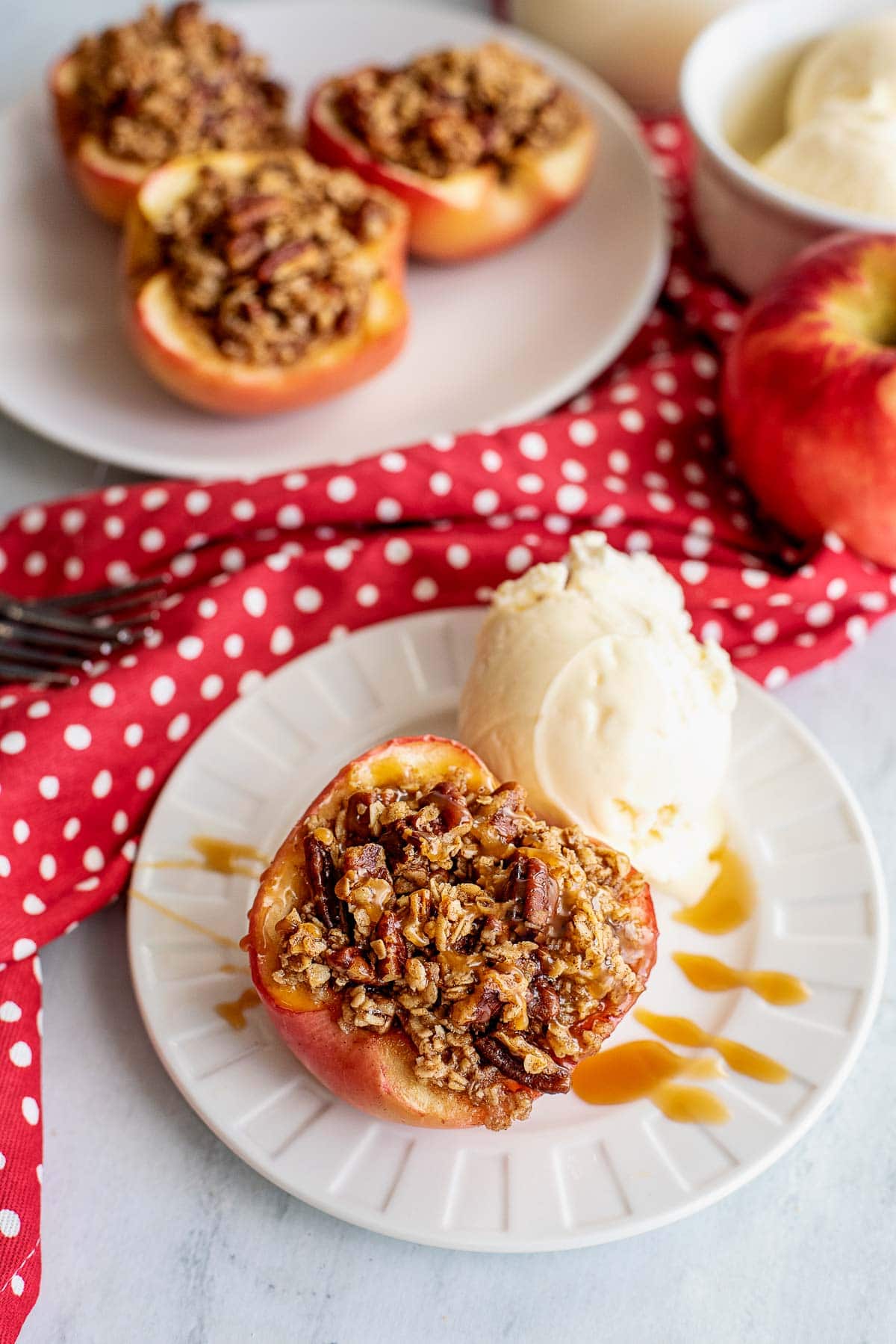 baked apple with vanilla ice cream on plate