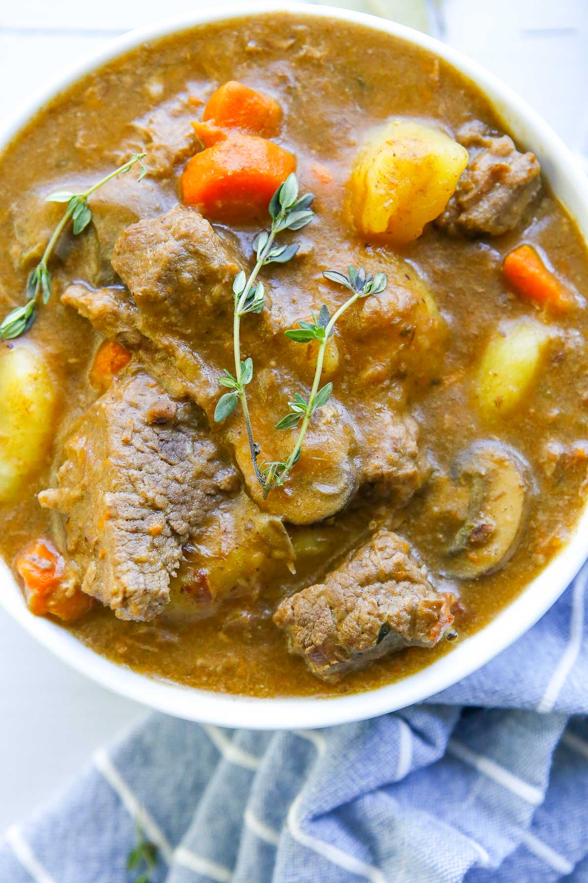 beef bourguignon in a bowl close up 