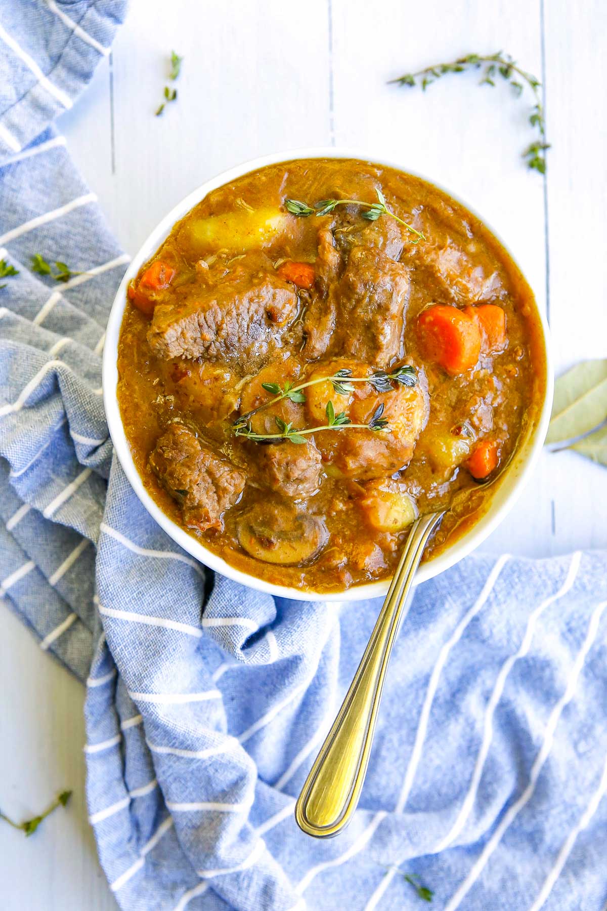 beef bourguignon in a bowl with spoon