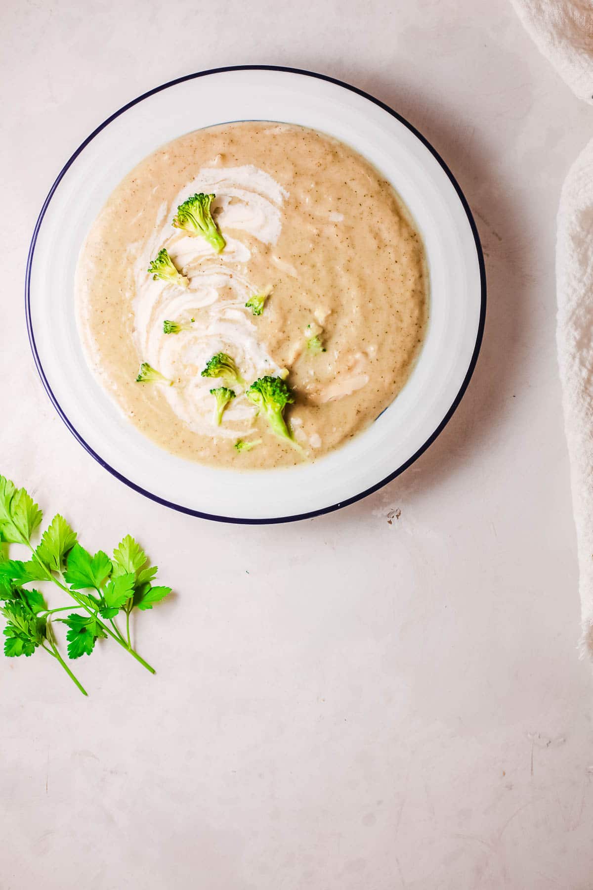 broccoli cheese soup in a bowl with cilantro 