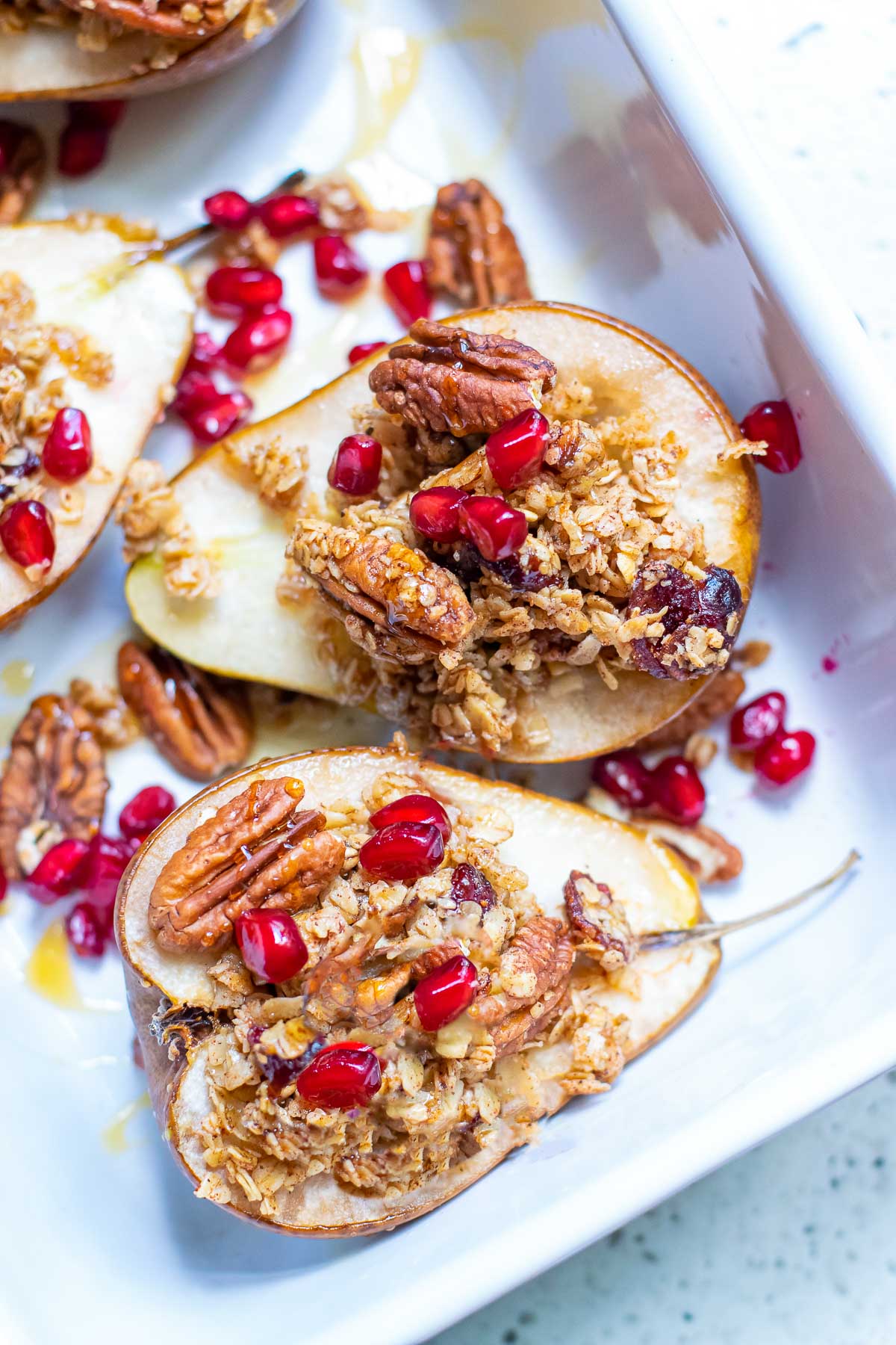 2 baked pears with pomegranate seeds