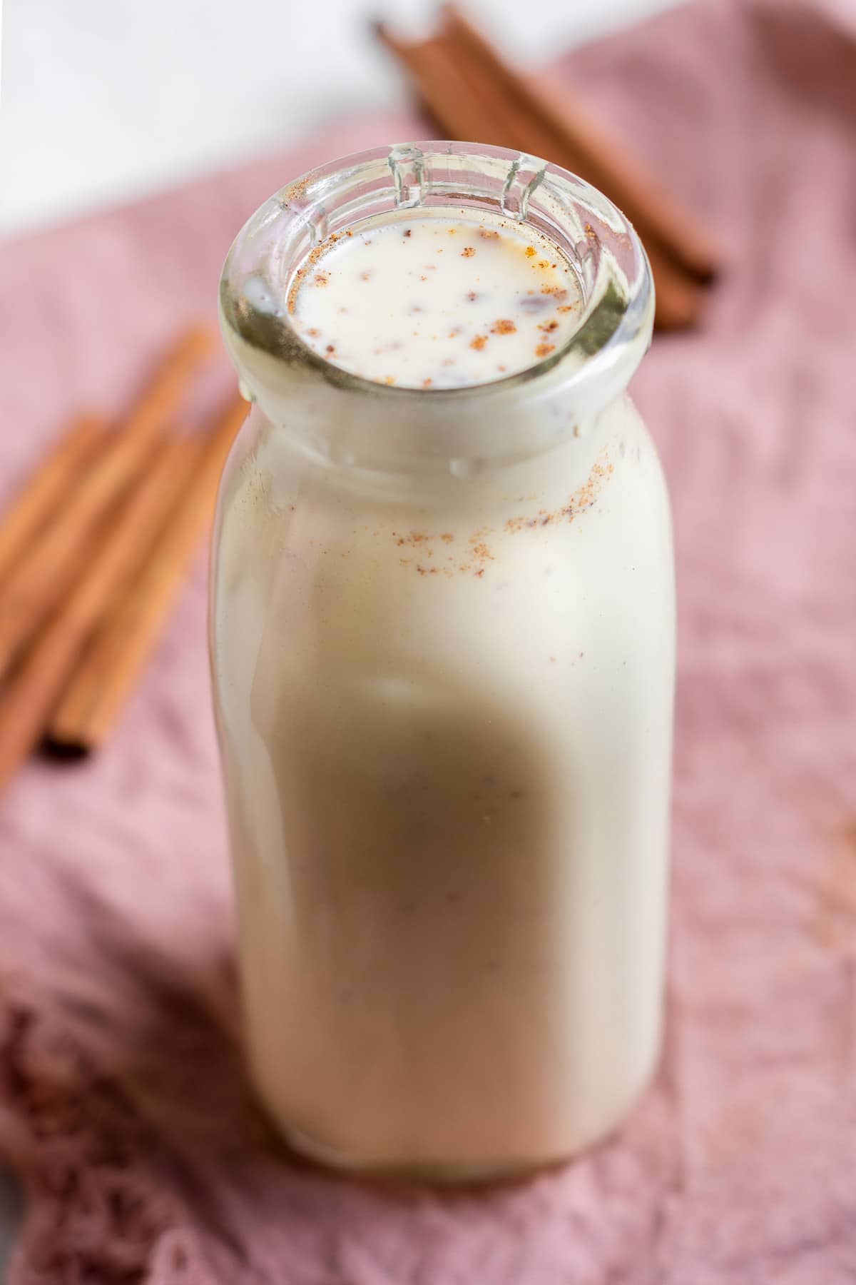 egg nog in bottle with nutmeg