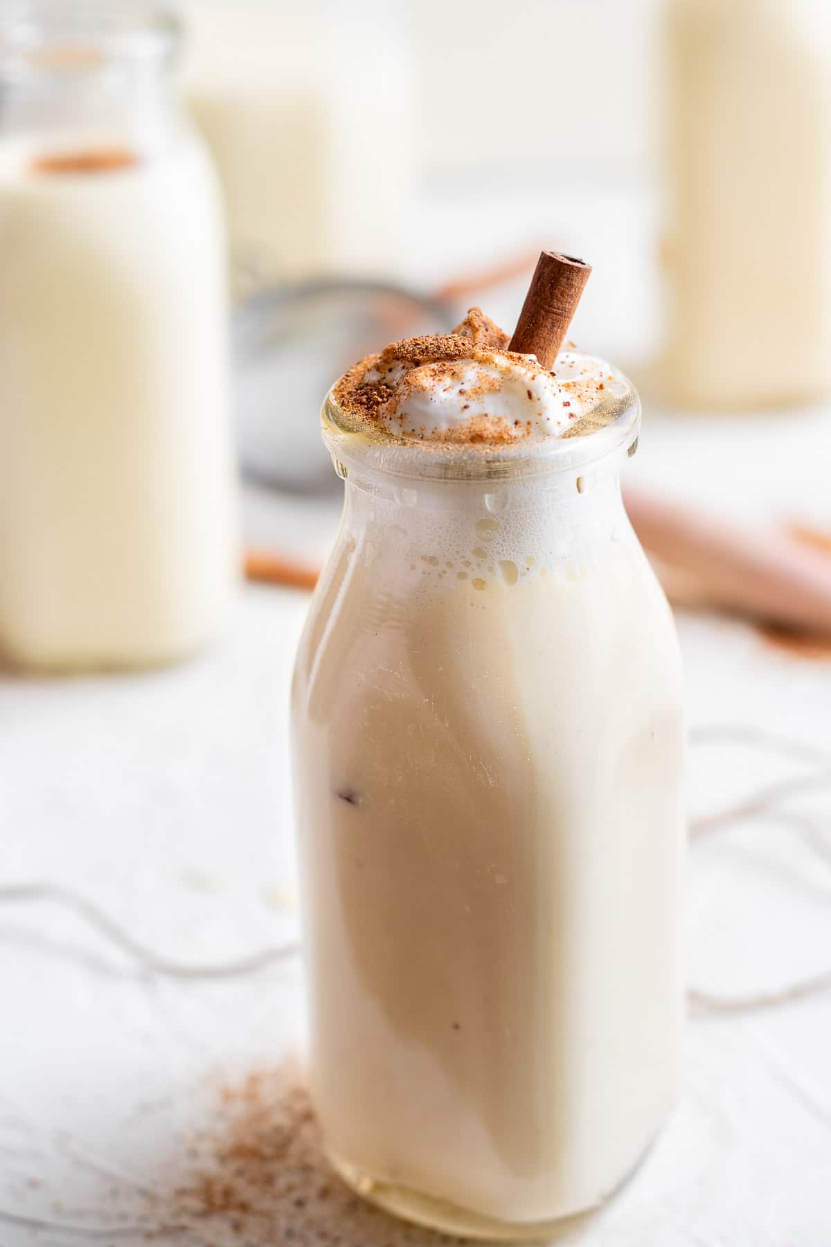 eggnog with whipped cream and nutmeg