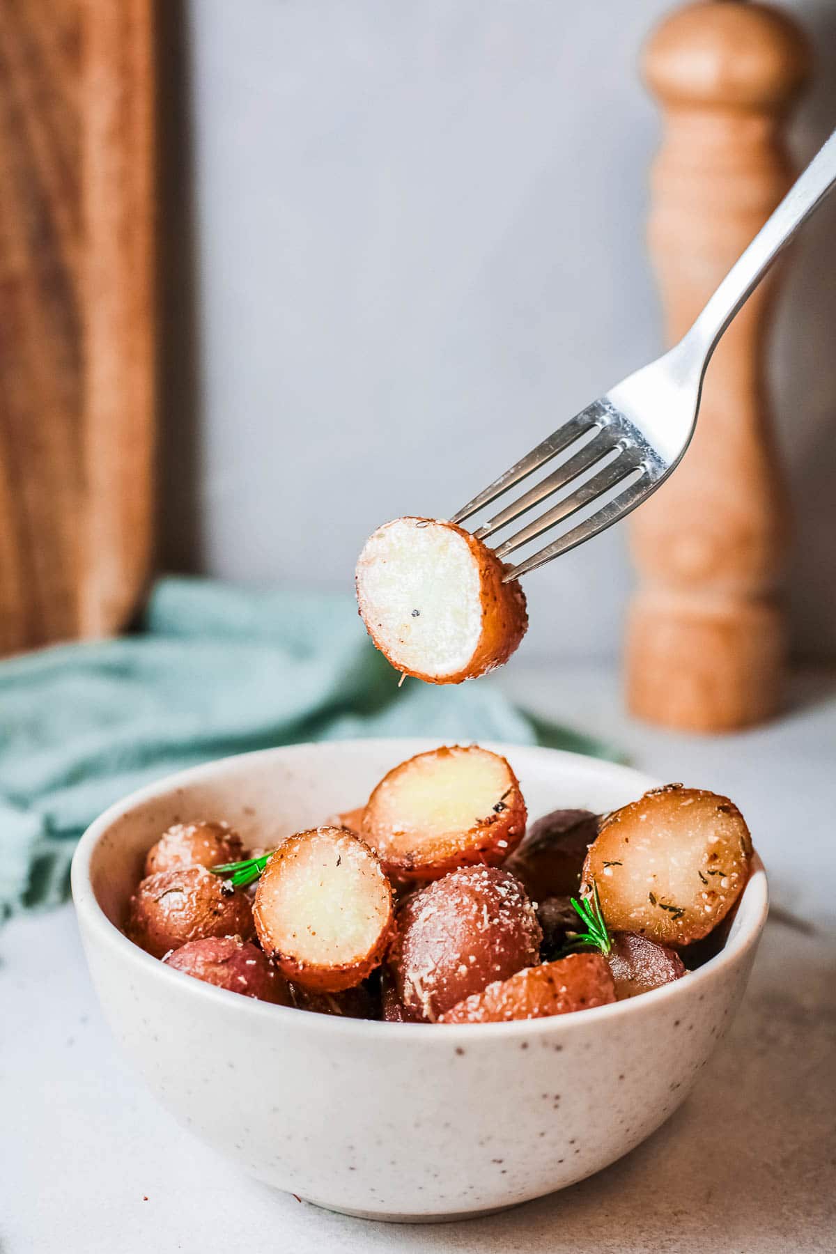 parmesan roasted potatoes with fork