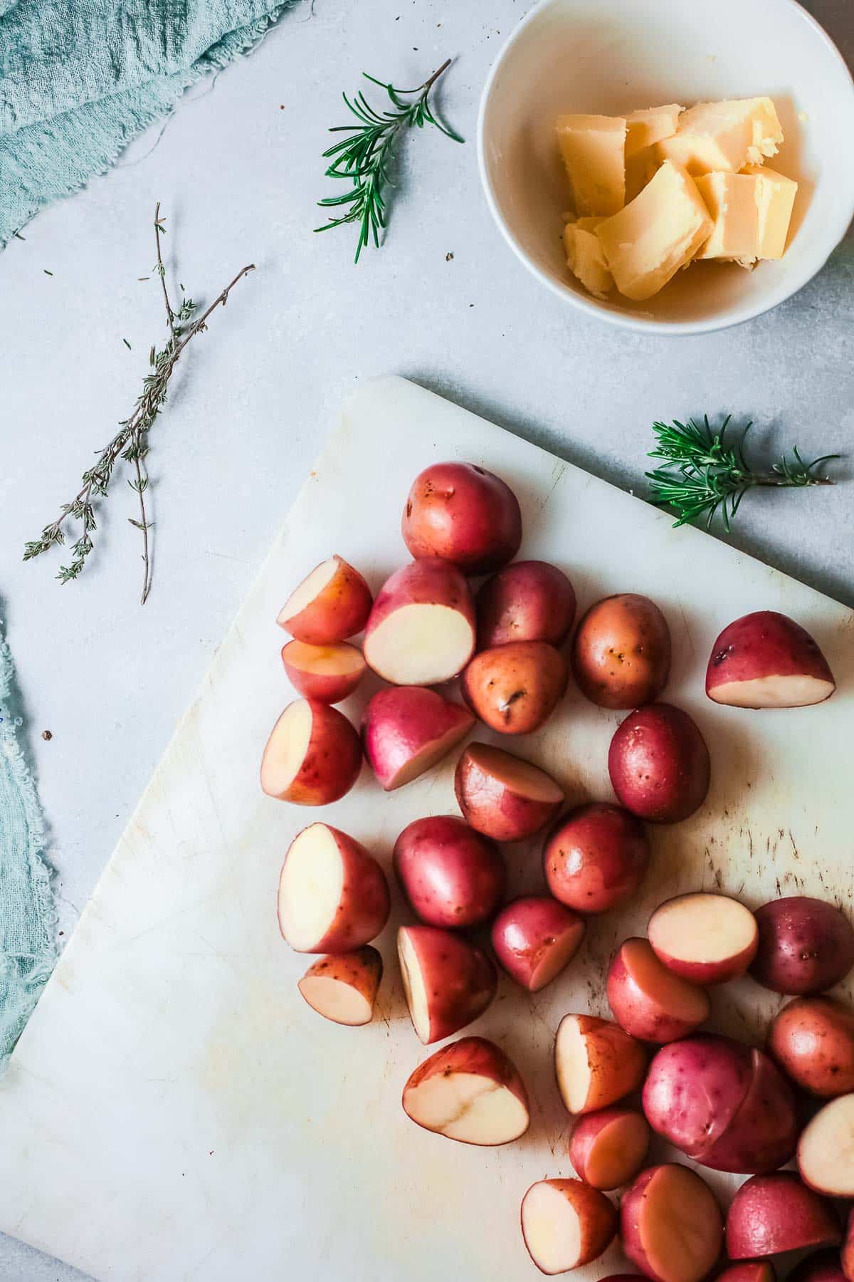 halved red potatoes on cutting board
