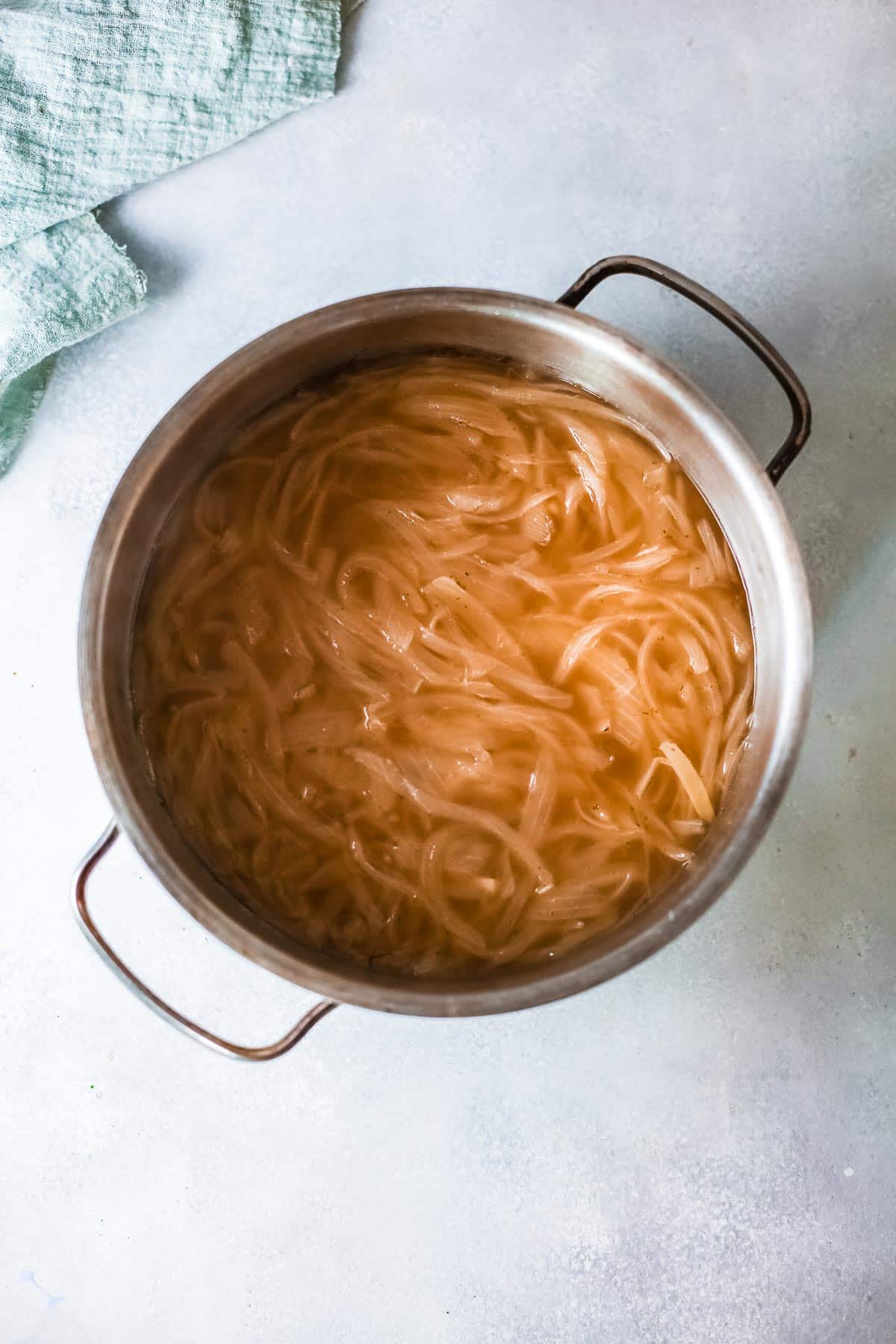 french onion soup in a stock pot