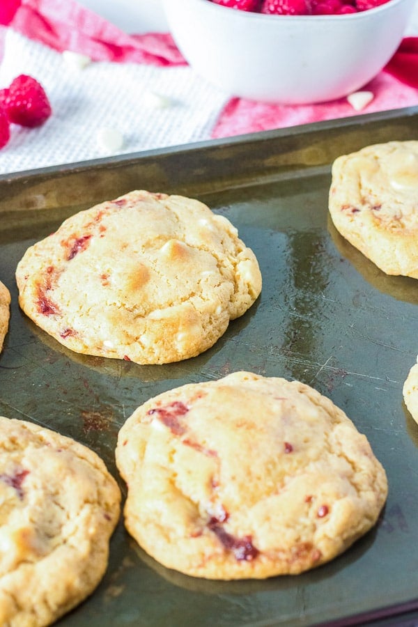 raspberry cheesecake cookies on baking sheet 