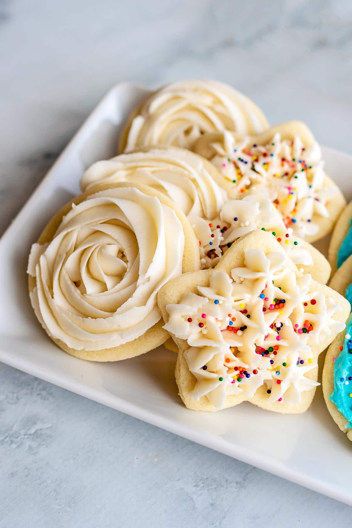 sugar cookies with piped frosting close up