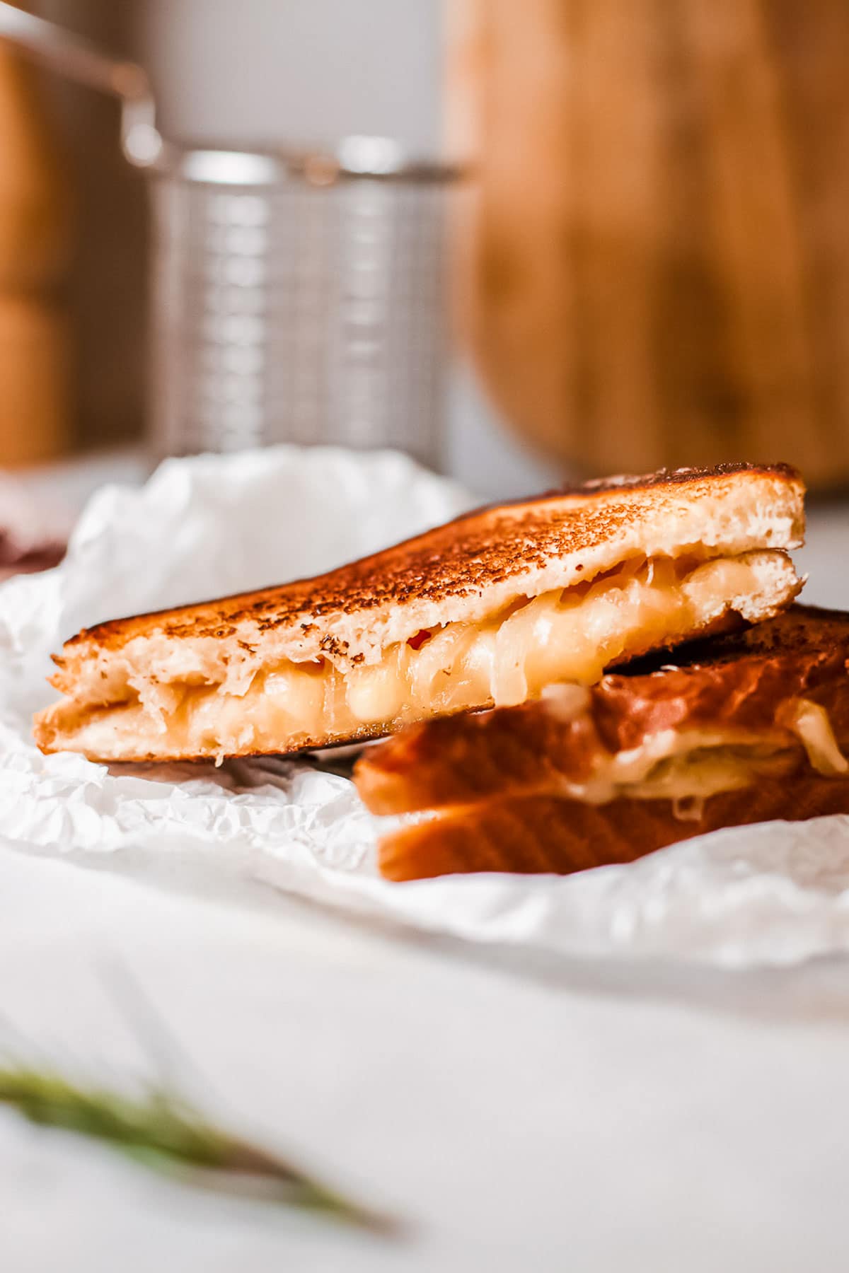 French onion grilled cheese sandwiches halves close up