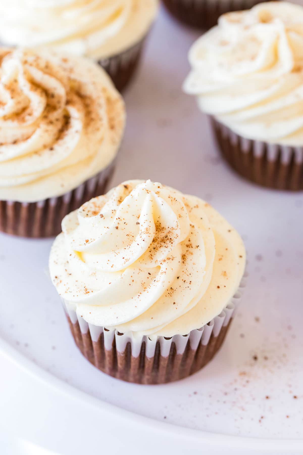 gingerbread cupcakes with eggnog frosting on plate
