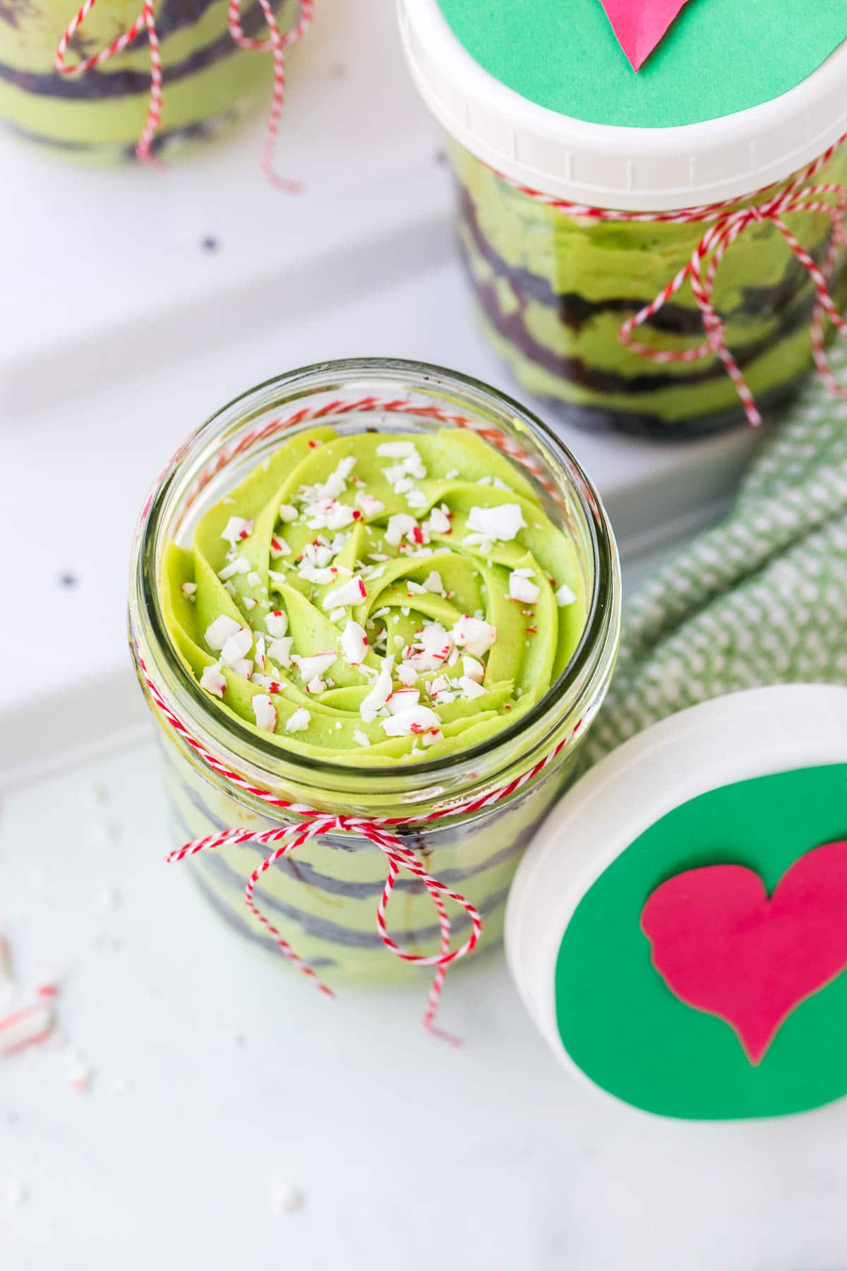 green frosting with peppermints on grinch cake 