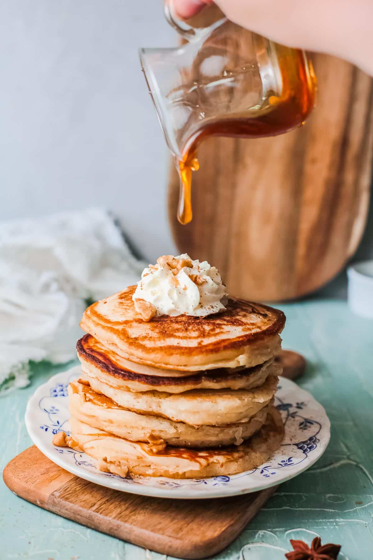 stack of eggnog pancakes with syrup 