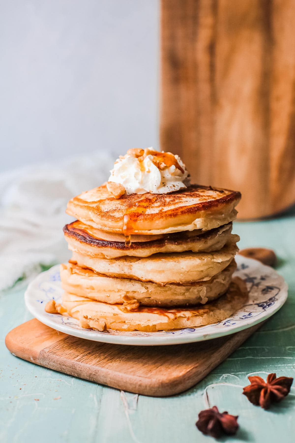 stack of eggnog pancakes with syrup