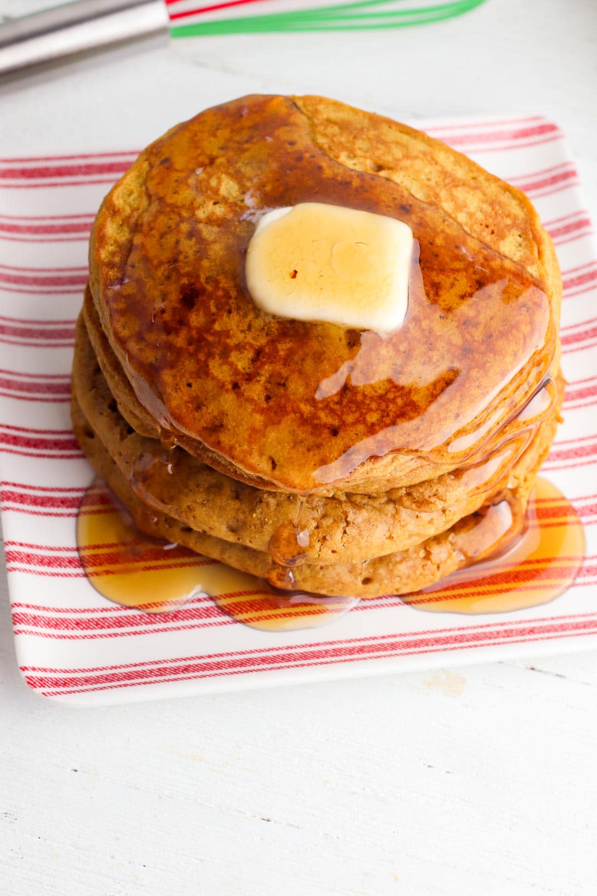 stack of gingerbread pancakes with butter