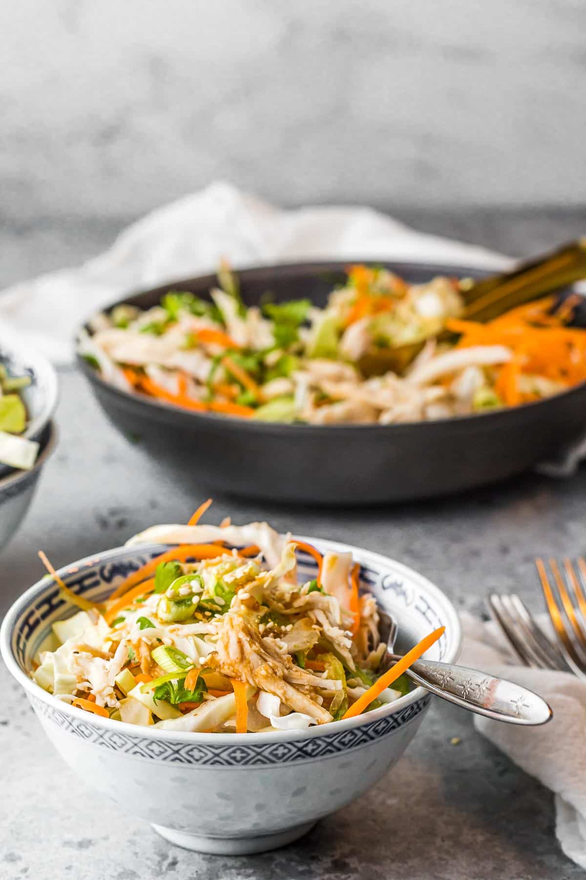 Asian salad in a bowl with fork