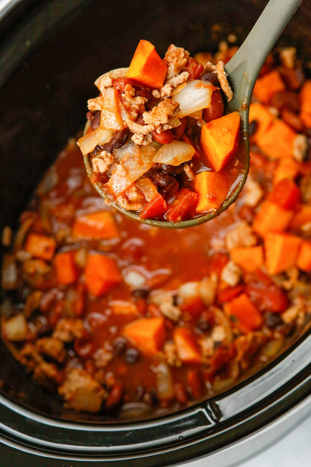 turkey chili in a soup ladle