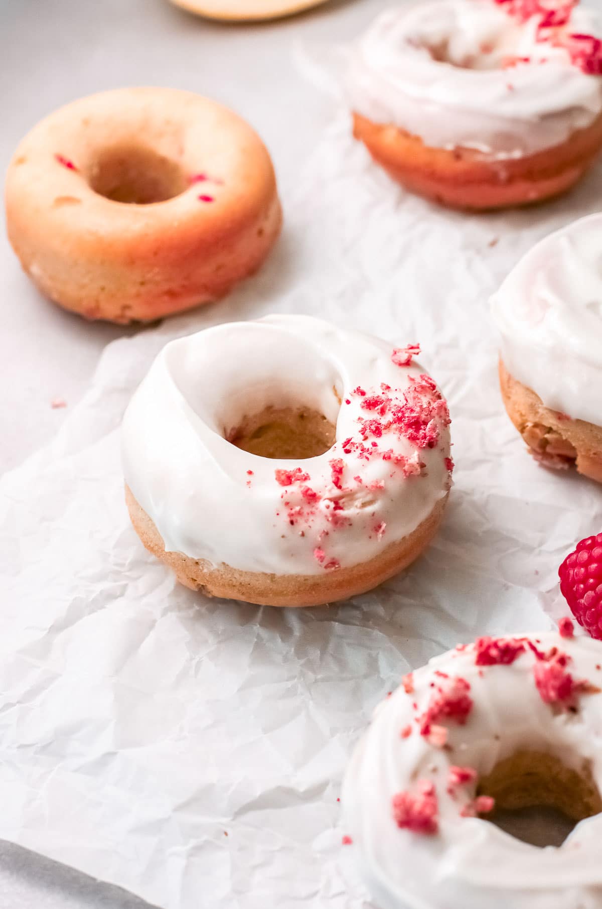 baked donuts glazed with freeze dried raspberry