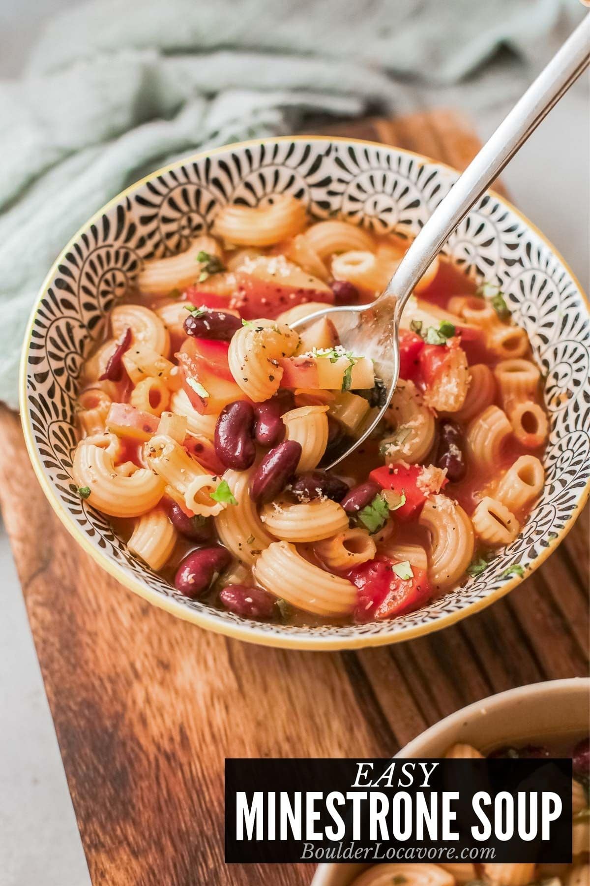 bowl of minestrone soup with spoon 