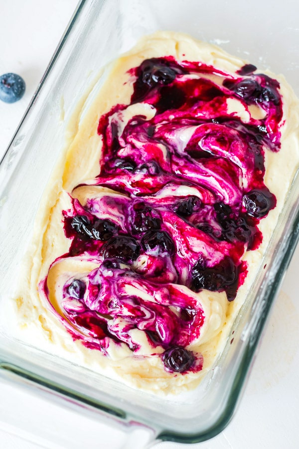 mixing blueberry swirl into lemon pound cake before baking