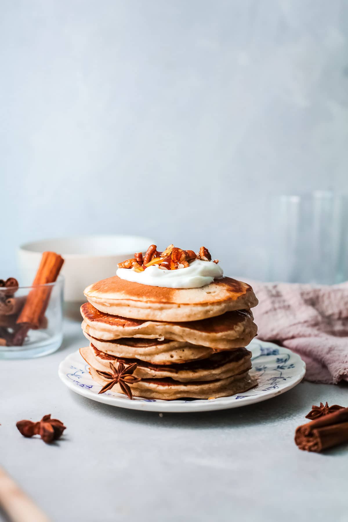 cinnamon pancakes stack with nuts on top 