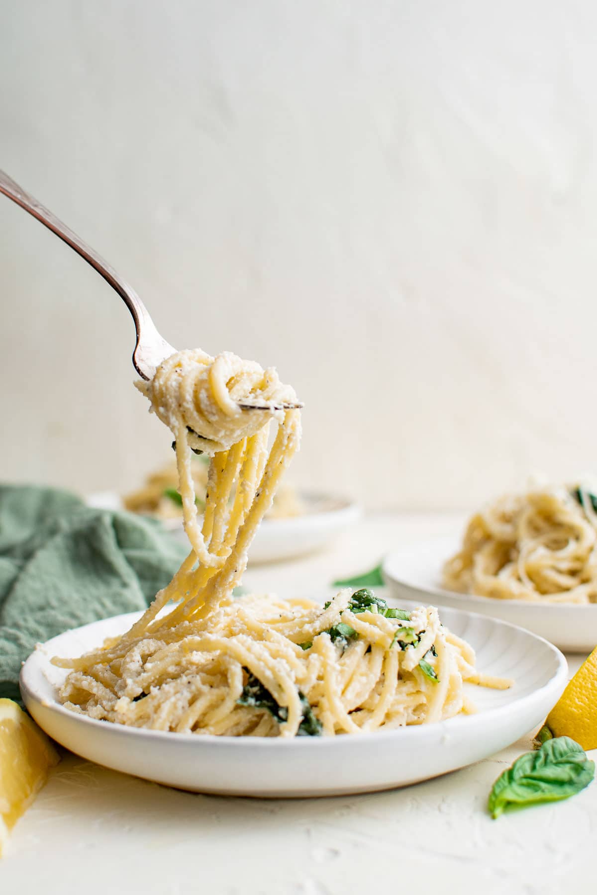 ricotta and spinach pasta with fork pull