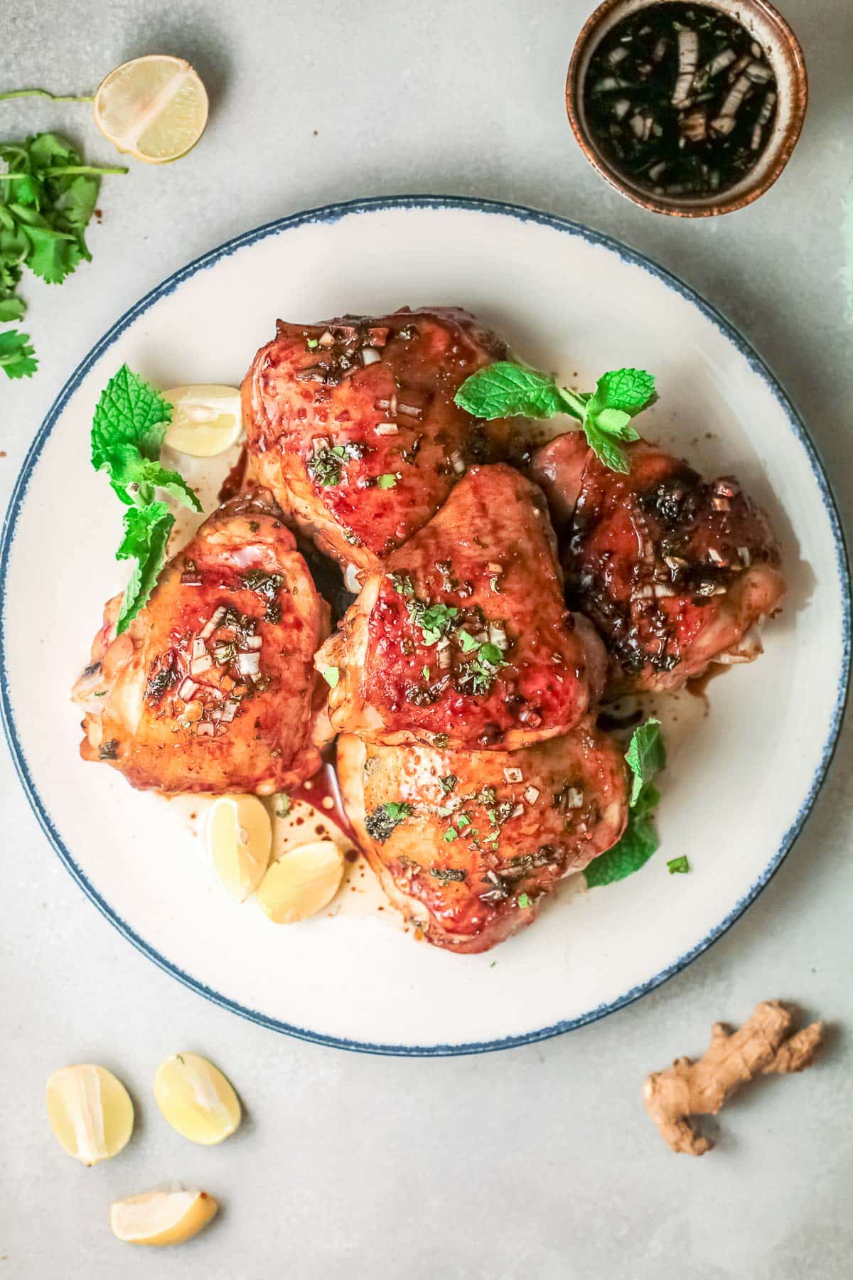 cooked vietnamese chicken thighs on plate overhead