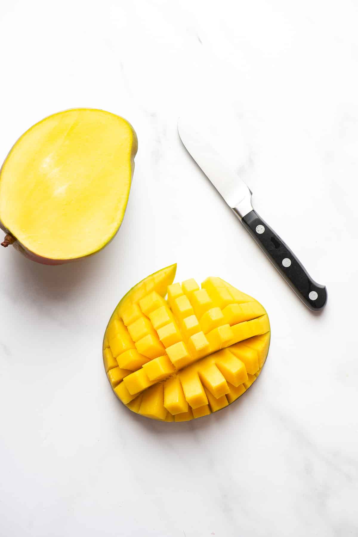 cut mango pieces on skin