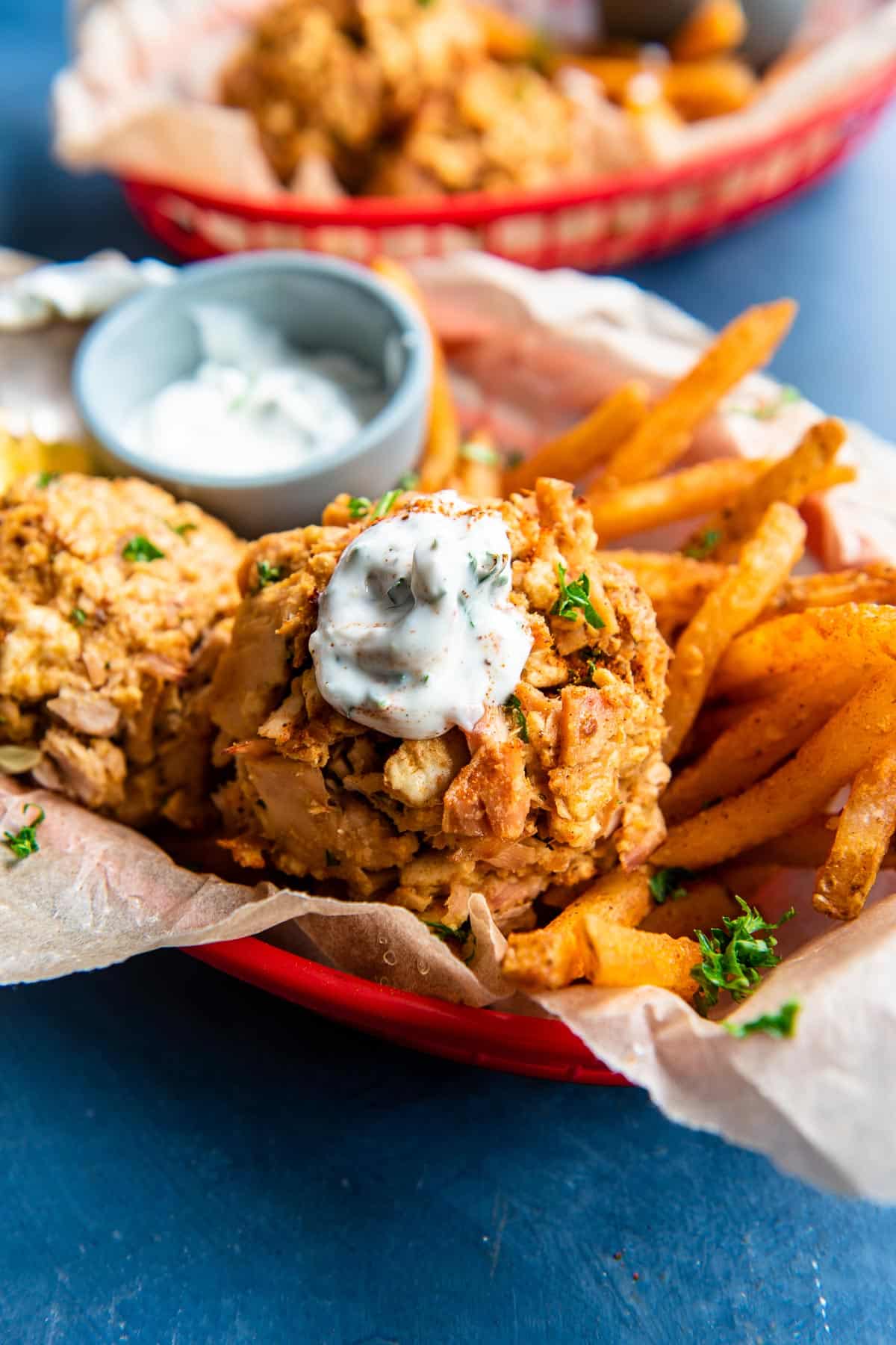 tuna cakes with fries in basket 