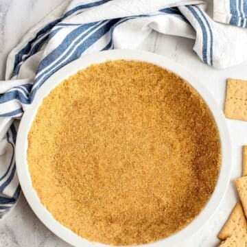 graham cracker pie crust in white pie pan