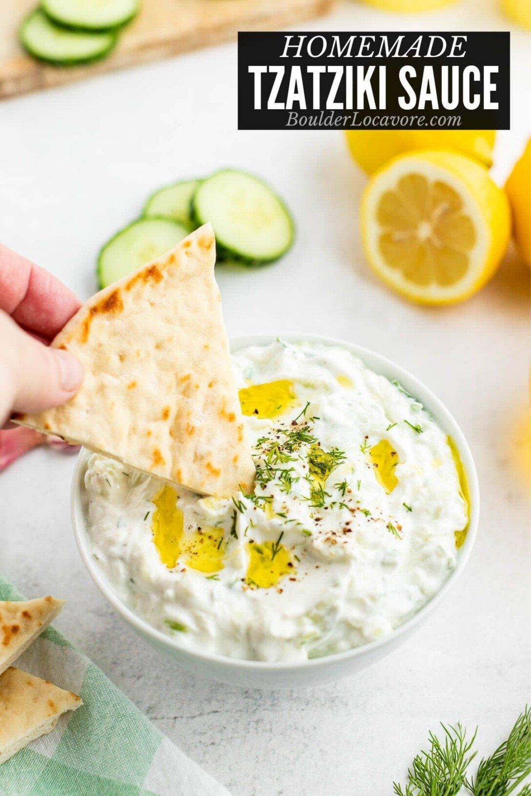 Tzatziki Sauce with a pita wedge being dipped title image