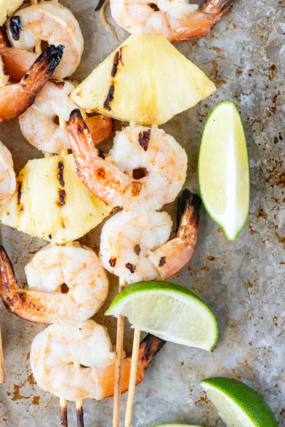 close up of shrimp and pineapple skewers