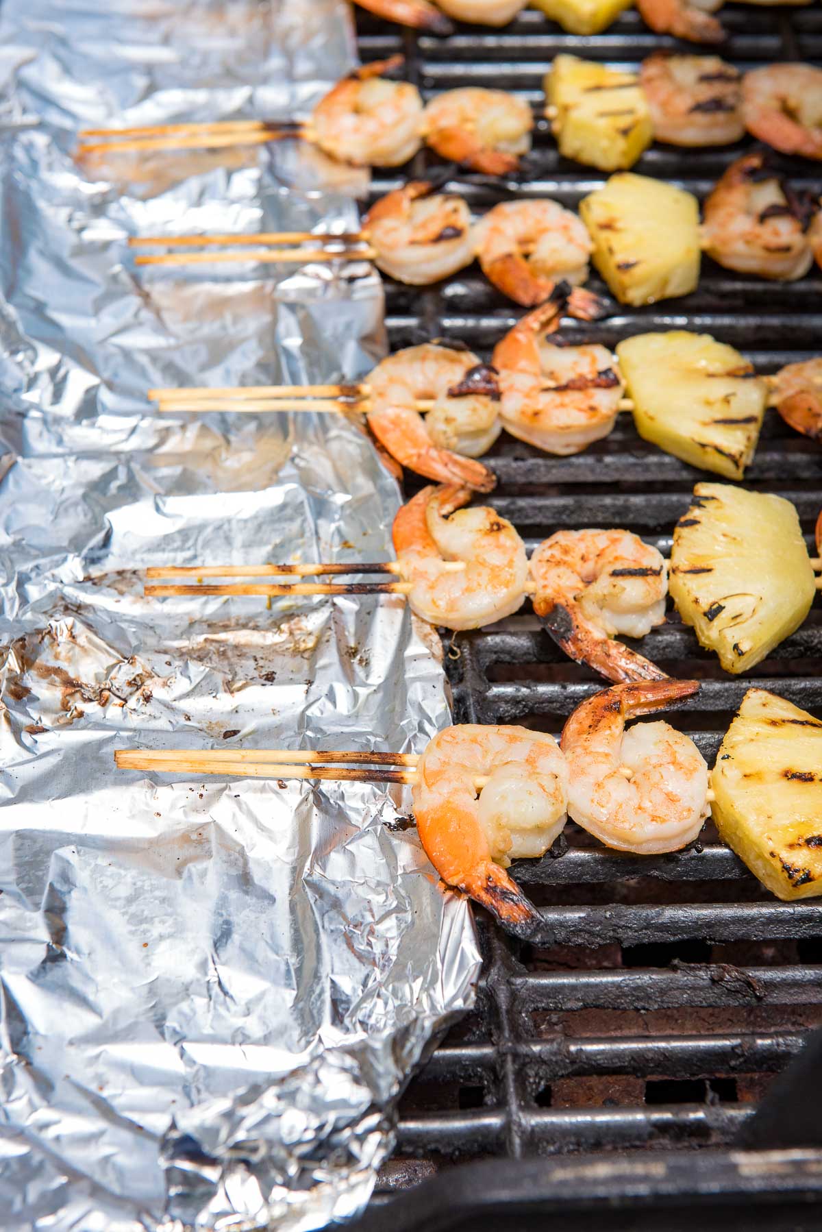 grill with shrimp skewers on grill